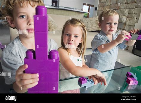 Children Playing with Building Blocks Stock Photo - Alamy