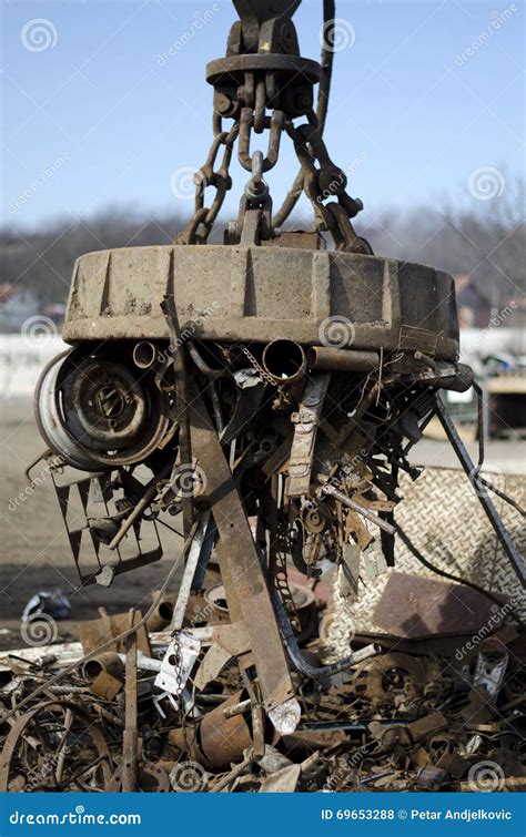 Scrap metal electro magnet stock photo. Image of junkyard - 69653288