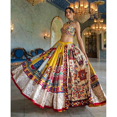 Yellow print and mirror work gujarati garba navratri lehenga chaniya c ...