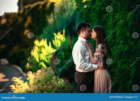 Beautiful Young Couple on a Nature Background Stock Image - Image of kiss, bright: 99195509