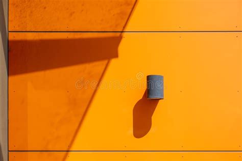 Cylinder Lamp on Modern Orange Wall. Stock Image - Image of cylinder ...