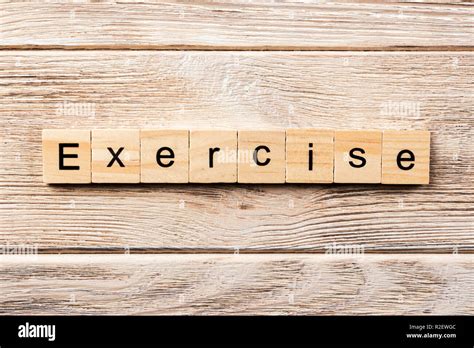 exercise word written on wood block. exercise text on table, concept Stock Photo - Alamy