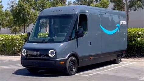 Inside Amazon's new electric delivery van that includes branded headlights and an automatic door ...