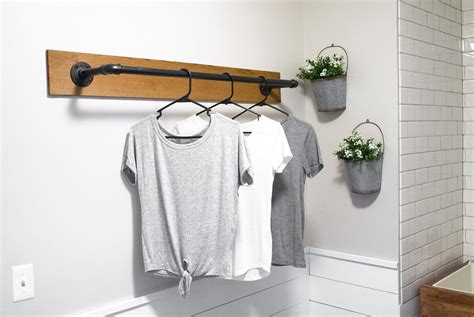 DIY Wall Mounted Clothing Rack | Sammy On State | Wall mounted clothing rack, Laundry room diy ...