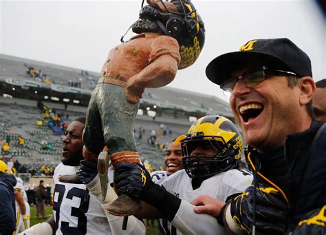 Michigan vs. Michigan State football rivalry: One photo from each game