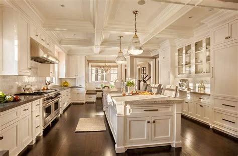 Massive white kitchen with ornate coffered ceiling in galley layout ...