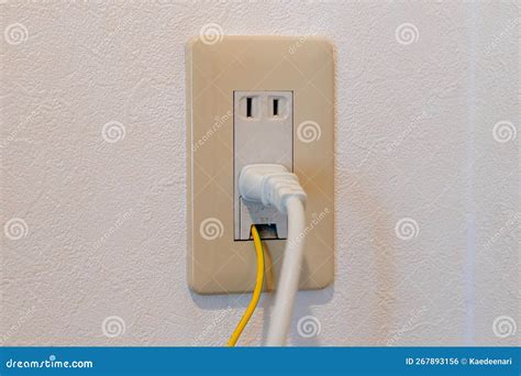 Power Plug and Earth Wire Connected To Japanese Electrical Outlet ...