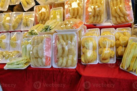 Fresh cut fruit wrapped in plastic selling at street market pomelo mango durian mango jackfruit ...