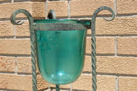 Stands - A gorgeous wrought iron plant stand with a large stunning emerald green glass bowl was ...