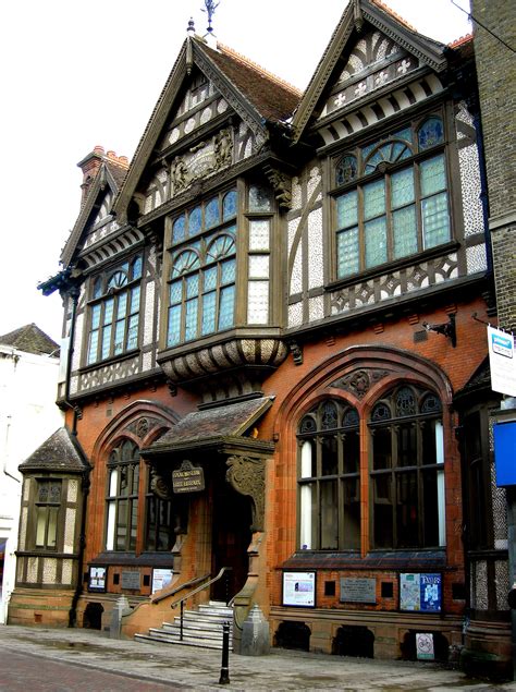 Half-timbering, Gothic Revival tracery and Jacobean carved porch brackets combine in the Tudor ...