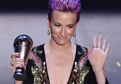 Megan Rapinoe USWNT holds up her 2019 FIFA Player of the Year trophy while ack | Uswnt, Megan ...