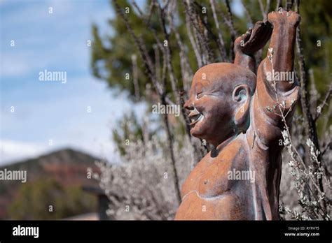 Smiling Buddha Statue Stock Photo - Alamy