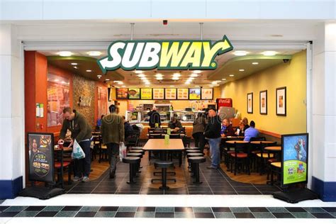 SUBWAY restaurant. Open front in shopping mall as people buy fast food ...