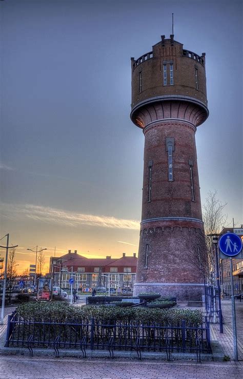 Den Helder; Watertower rises above the sunset | Water tower, Visit ...