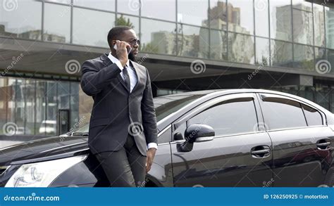 Serious Rich Man in Expensive Business Suit Talking Over Phone in Big ...