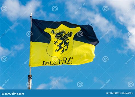 Kashubia Flag with Coat of Arms of Kaszebe on Blue Sky Stock Photo ...