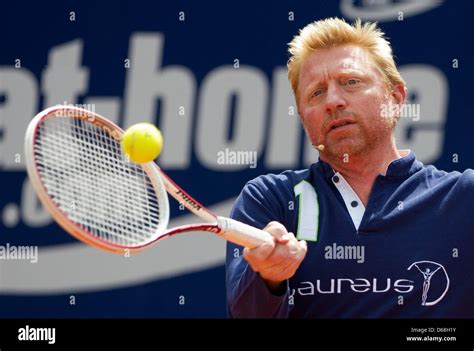 Former professional tennis player Boris Becker hits a tennis ball ...