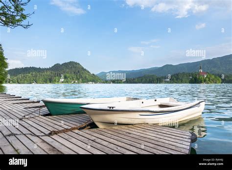 Traditional wooden boats Pletna on Lake Bled, Triglav National Park, Upper Carniolan, Slovenia ...