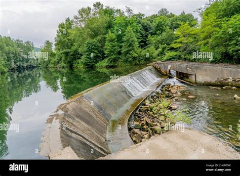 Small hydroelectric power plant in the river, France. Operating since the 60s. High quality ...