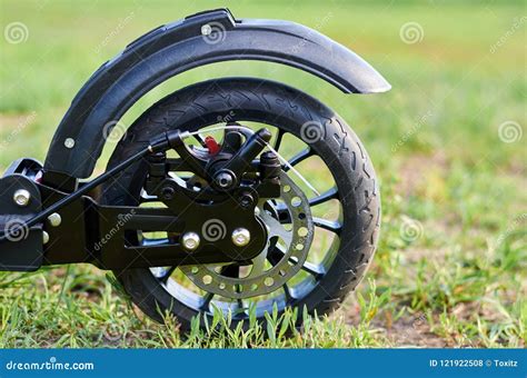 Black Folding Kick Scooter, Close Up Parts, Rear Wheel with Disk Brakes ...