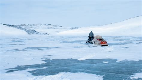 Snowmobiling over Arctic Ocean & Frozen Tundra in Nunavut - Voyageur ...