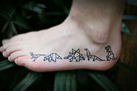 So happy with these guys! #tattoo #dinos #dinosaur #origami #foot ...