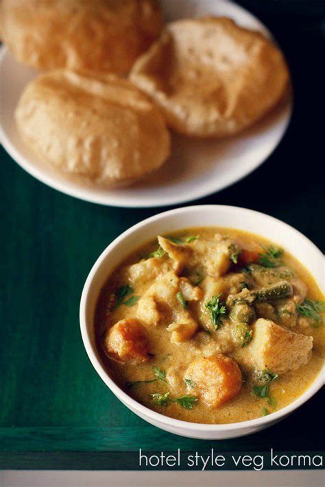 two bowls filled with soup next to rolls