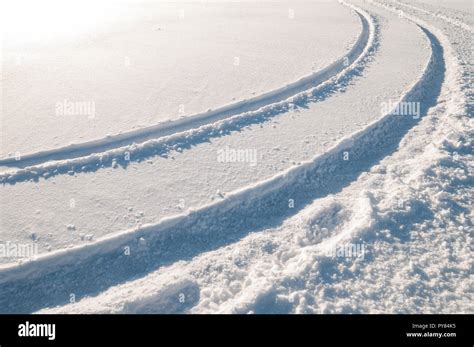 Tire tracks in snow Stock Photo - Alamy