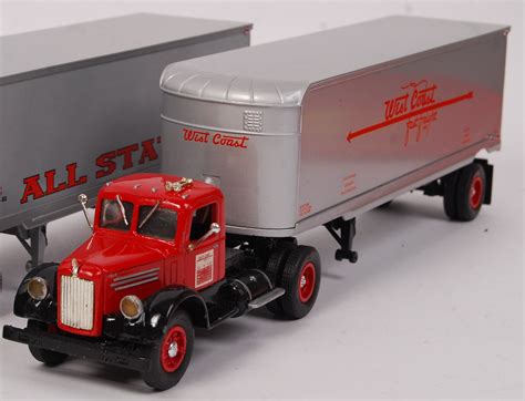 A collection of 5x American made First Gear 1:34 scale precision diecast model lorries / Mack tru