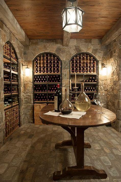 Basement wine room features a wood plank cieling over stone walls ...