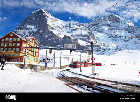 Famous train (Jungfrau railway) goes to Alpine mountain resort with famous Eiger, Monch and ...