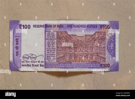 Back of new Indian 100 Rupee note on plain background Stock Photo - Alamy