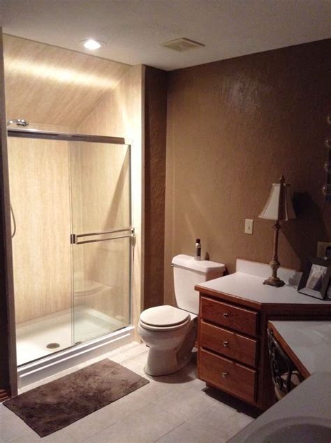 We removed a boring, one piece fiberglass shower, and replaced it with a new shower base and ...