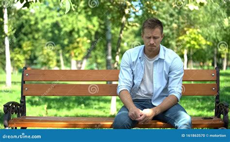 Sad Man Sitting On Bench