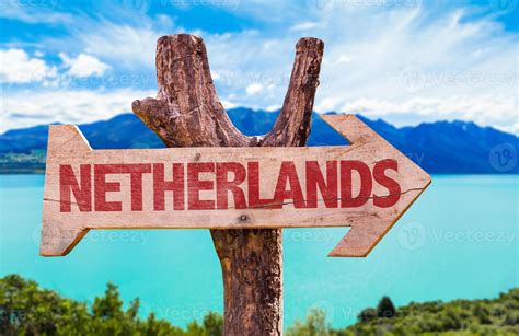 Netherlands Flag wooden sign with river on background 1366525 Stock Photo at Vecteezy