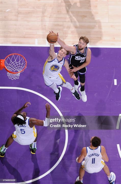 Brandin Podziemski of the Golden State Warriors and Domantas Sabonis... News Photo - Getty Images