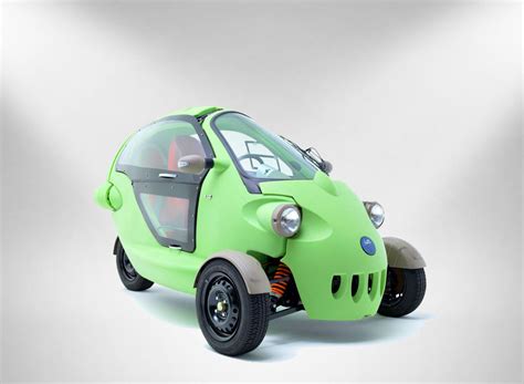 sam is a bug-eyed three-wheeled two-person electric vehicle