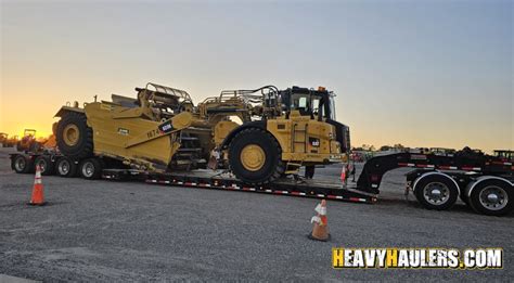 Transporting a Half-a-Million Dollar Scraper on an Extendable RGN Trailer | May Featured ...