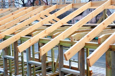 Installation of Wooden Beams at Construction the Roof Truss System of the House. Stock Image ...