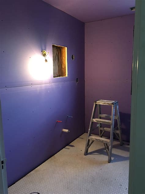 Bathroom walls! The purple drywall is meant for moisture resistance. I promise we will not be ...