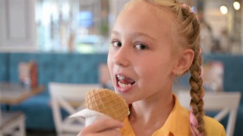 Adorable Person Enjoying Ice Cream Cone With Stock Footage SBV-317674727 - Storyblocks