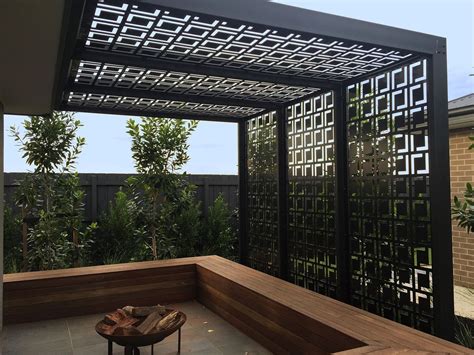 a wooden bench sitting under a pergolated roof