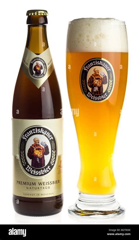 Bottle and glass of German Franziskaner wheat beer isolated on a white background Stock Photo ...