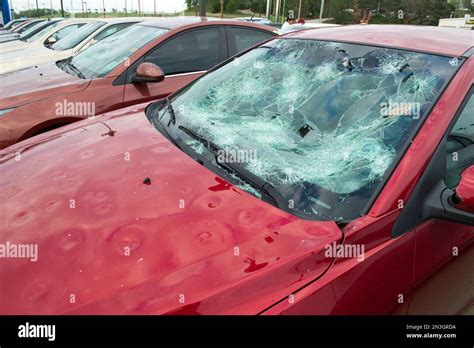 Parked car with severe hail damage; Blair, Nebraska, United States of America Stock Photo - Alamy