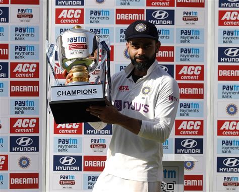 Virat Kohli poses with the trophy | ESPNcricinfo.com