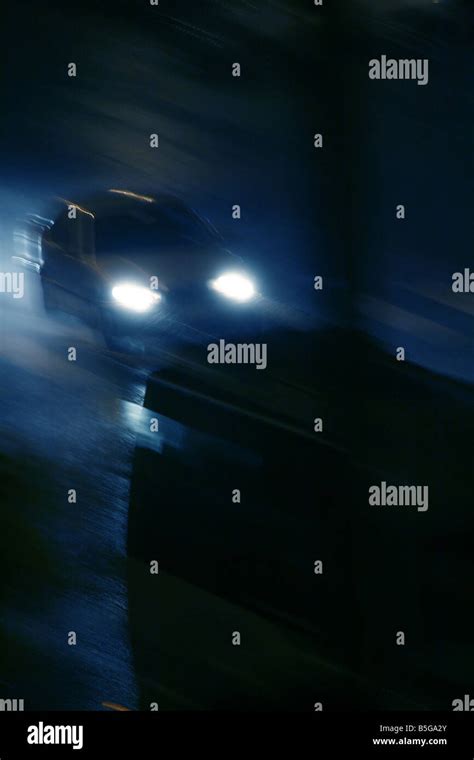 fast car driving in heavy rain at night in town Stock Photo - Alamy