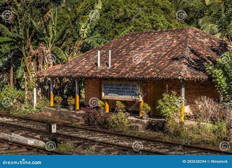 A Picture of a Small Train Station on a Train Track Stock Photo - Image ...