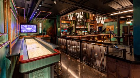 Electric Shuffle Canary Wharf | Dazzling Tabletop Shuffleboard Bar