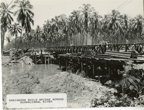 A view of a bridge being constructed in the jungles of Guadalcanal ...