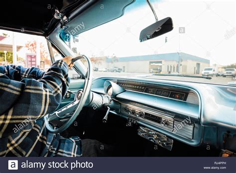 Man driving vintage car Stock Photo - Alamy